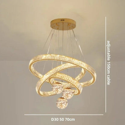 Lustre Dimoree moderne en cristal doré avec trois anneaux lumineux suspendus pour salon ou salle à manger