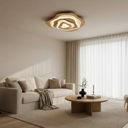 Plafonnier LED Dimoree en forme de nuage en bois clair installé dans un salon moderne aux tons neutres et chaleureux.