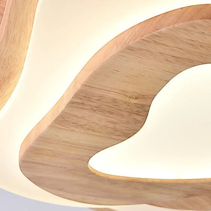 Plafonnier LED Dimoree en bois naturel avec design en forme de nuage diffusant une lumière douce et chaleureuse