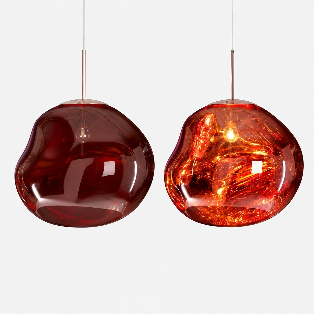 Suspension lumineuse Dimoree en verre soufflé ambré aux formes organiques et reflets dorés pour intérieur moderne.